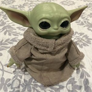 Baby Yoda toy. Great condition.